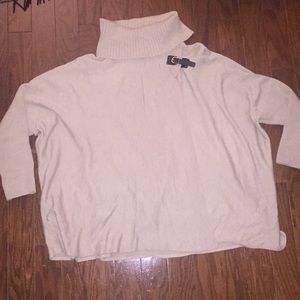 Cape poncho like sweater with turtleneck